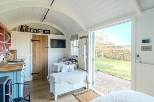 a small room with a table and a window at Red Robin Retreat in Broadway