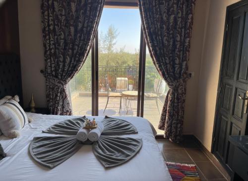 Ένα ή περισσότερα κρεβάτια σε δωμάτιο στο Dar le Domaine, Tennis, Foot, Piscine et basket