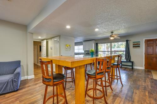 a kitchen with a large wooden bar with stools at Dock and Beautiful Views! Spacious Bellows Lake Gem in Tampa