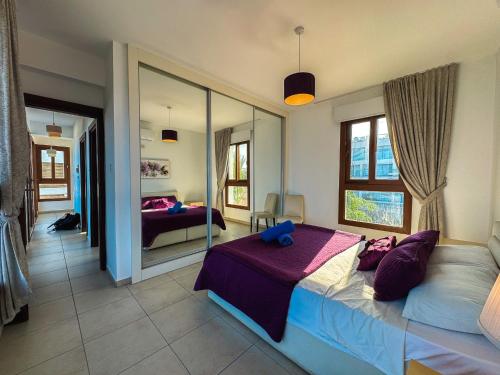 a bedroom with a bed and a large mirror at Villa Sea Cliff 1 in Kyrenia