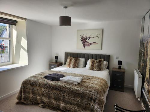 Ένα ή περισσότερα κρεβάτια σε δωμάτιο στο The Station Hotel Insch