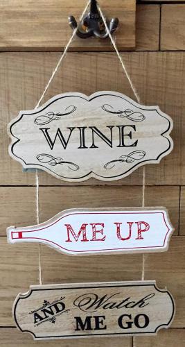 two signs that say wine and me up at Billycan in Tenby