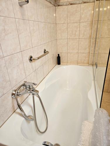 Koupelna v ubytování FAMILLE Apartman