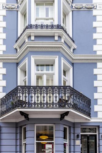 a blue building with a balcony on it at Brightonwave in Brighton & Hove