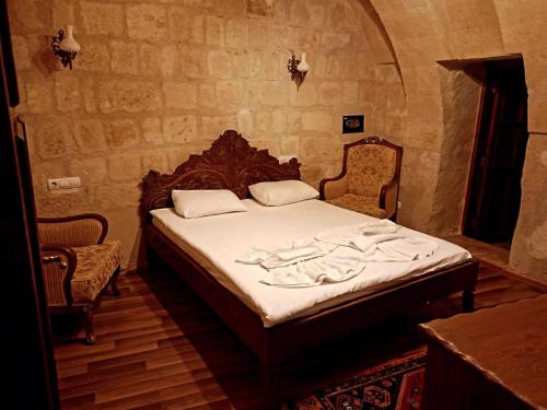 En eller flere senge i et værelse på Bella Vista Stone House