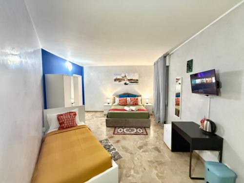 a bedroom with a bed and a tv in it at Casa Raffinata in Mestre