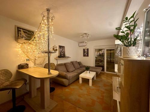a living room with a couch and a table at Sea View Budva in Budva