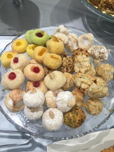 a plate of different types of donuts on a table at Hotel Perla Gaia in San Vito lo Capo