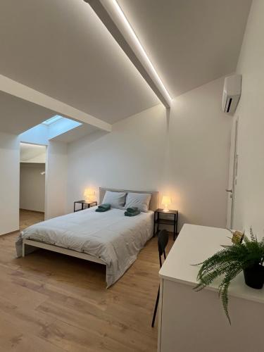 En eller flere senge i et værelse på Résidence Nova