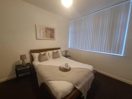 a bedroom with a bed with a bowl on it at Pudding Chare Apartments in Newcastle upon Tyne