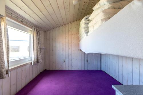 En eller flere senge i et værelse på Rømø familiecamping