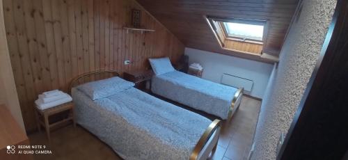 Ένα ή περισσότερα κρεβάτια σε δωμάτιο στο Mansarda Anna e Marco