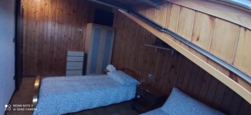 Ένα ή περισσότερα κρεβάτια σε δωμάτιο στο Mansarda Anna e Marco