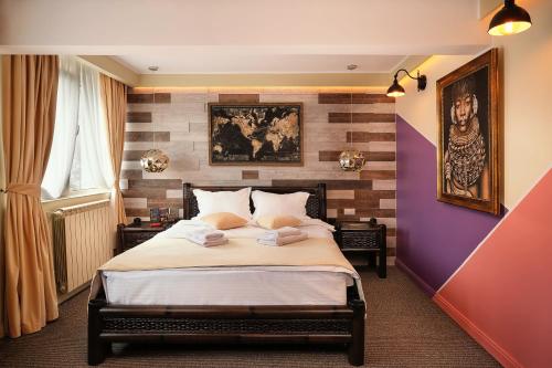 En eller flere senge i et værelse på Independentei-Spiridon Central Apartaments