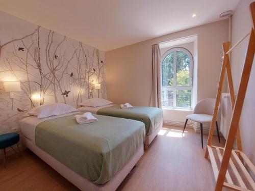Ένα ή περισσότερα κρεβάτια σε δωμάτιο στο Séjour de luxe au Moulin de Bouchereau : Nature & Détente - FR-1-581-159