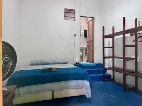 Ένα ή περισσότερα κρεβάτια σε δωμάτιο στο Casa à beira-mar em Paraty