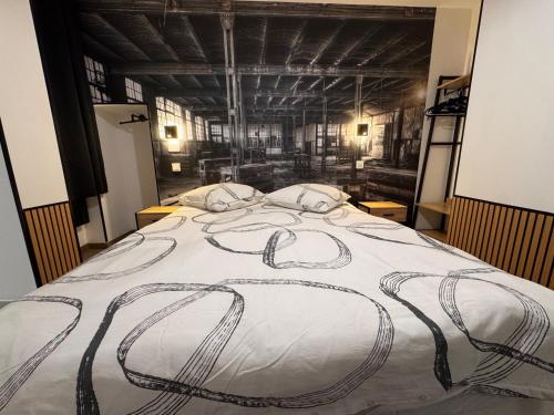 Ένα ή περισσότερα κρεβάτια σε δωμάτιο στο L'atelier