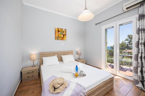 Postel nebo postele na pokoji v ubytování Villa Kostis