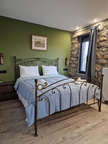 Postel nebo postele na pokoji v ubytování Vasiliki Pramanta villas