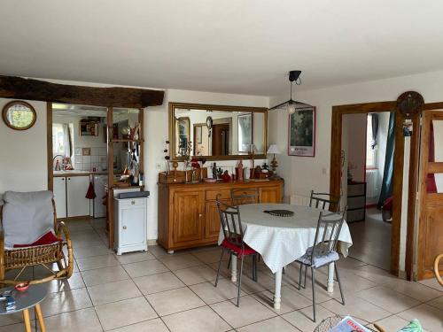 a kitchen with a table and chairs in a room at Maison quercynoise Coeur du causse 4 à 8 pers in Durbans