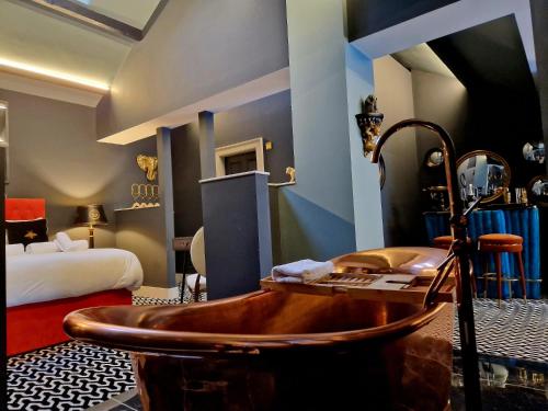 a hotel room with a tub and a bed at The Hamilton - The Studio luxury holiday let's in Scorton