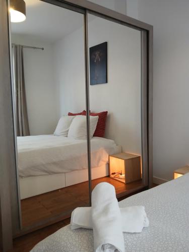 Postel nebo postele na pokoji v ubytování Le Vallier Catane