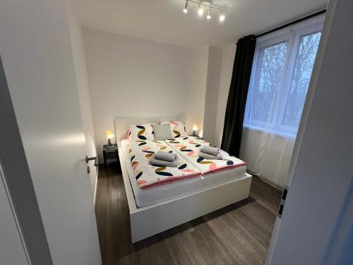 a bedroom with a bed with candles on it at Apartmány ASTRA in Cheb