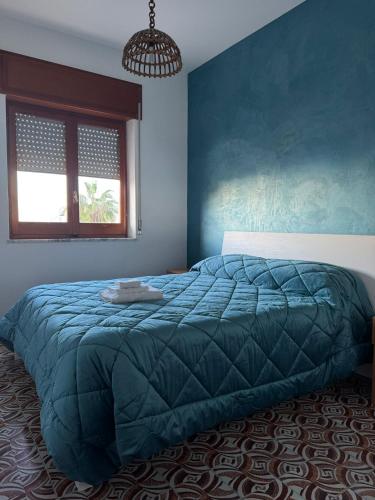 Ένα ή περισσότερα κρεβάτια σε δωμάτιο στο Al-Mar