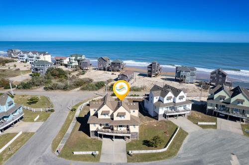 an aerial view of a beach with houses and the ocean at CAC-6B - Egret in Buxton