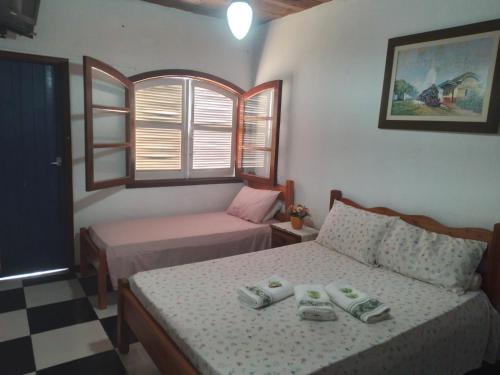 Postel nebo postele na pokoji v ubytování Pousada Terra do Ipê