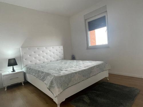 Postel nebo postele na pokoji v ubytování Apartament