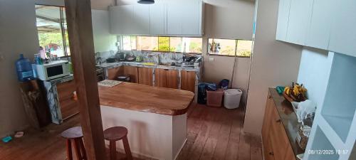 a kitchen with a sink and a counter top at Hacienda & Reserva Monterrico in Romilda