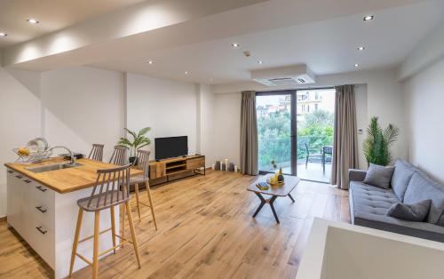 Una televisión o centro de entretenimiento en arvangroup-apartments