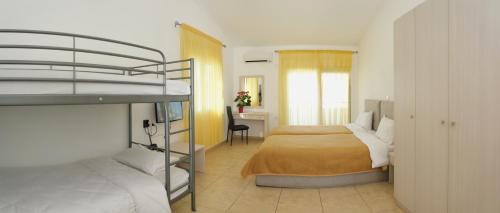 Ένα ή περισσότερα κρεβάτια σε δωμάτιο στο Kassiani Studios