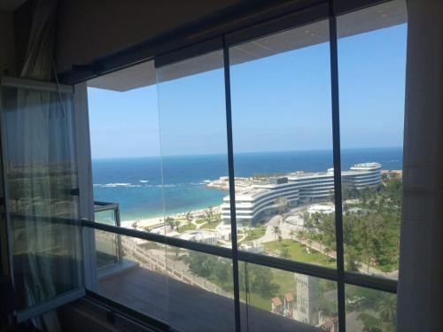 a window with a view of the ocean at Sheraton ganna view inn in Alexandria