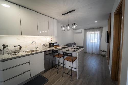 a kitchen with a sink and a counter top at VanTop Xisto in Pampilhosa da Serra