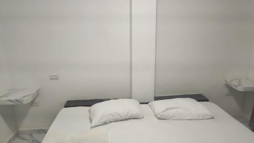 Ένα ή περισσότερα κρεβάτια σε δωμάτιο στο Hostal Manantiales La Esperanza