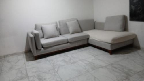 a couch and a chair in a living room at casa ex hacienda casasano in Cuautla Morelos