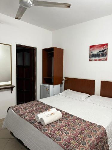 a bedroom with a bed with two towels on it at HOTEL REGINA Formosa in Formosa