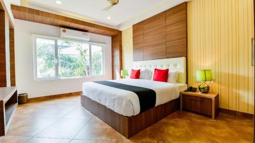 Ένα ή περισσότερα κρεβάτια σε δωμάτιο στο The Boho Cochin