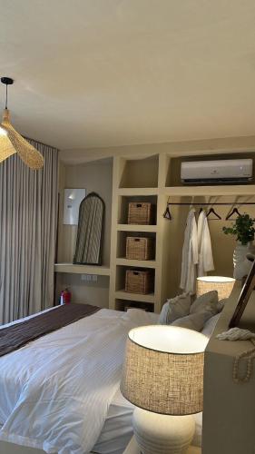 a bedroom with a bed and a table in it at نزل فاخر in Taif