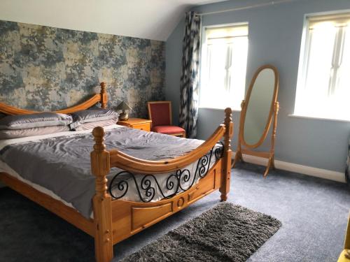 Rúm í herbergi á Wellfield house