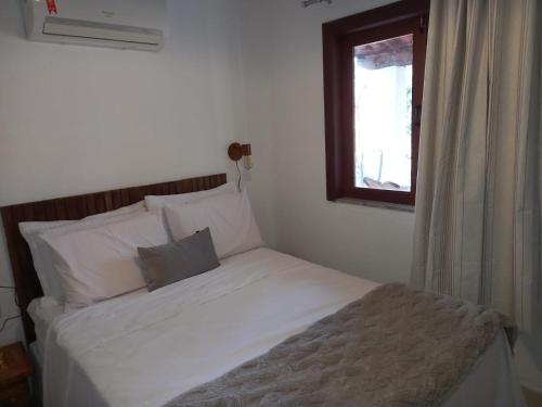 En eller flere senge i et værelse på Chalé Colibri