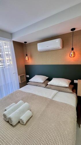 a bedroom with two beds with towels on them at Las Americas 200 B apartment in Costa de Adeje