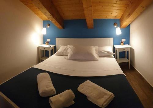 a bedroom with a large bed with two night stands at Vacanze nel Cilento in Agropoli