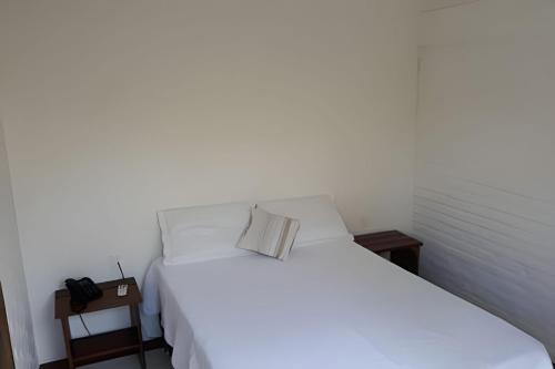 En eller flere senge i et værelse på Chalé Lua pé na areia na propriedade DivinoRecanto