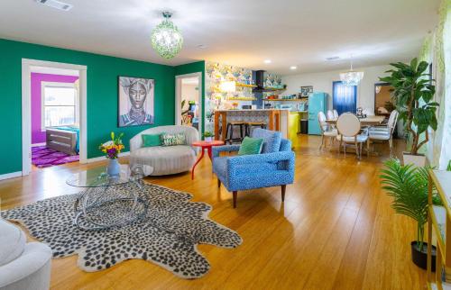 a living room filled with furniture and a table at Jungle Haven Heated Pool Fun for 12 in Johnson City