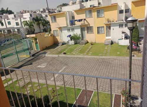 a view from the balcony of a house at Casa en fraccionamiento en Ahuatepec con alberca, cancha y cerca de Tepoztlán 