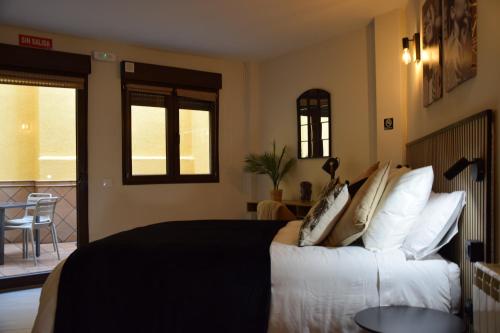 Ένα ή περισσότερα κρεβάτια σε δωμάτιο στο Alojamiento El Rincón de Rosa