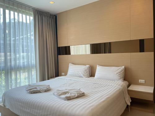 Ένα ή περισσότερα κρεβάτια σε δωμάτιο στο Royal Kamala - 1 separated bedroom Condo